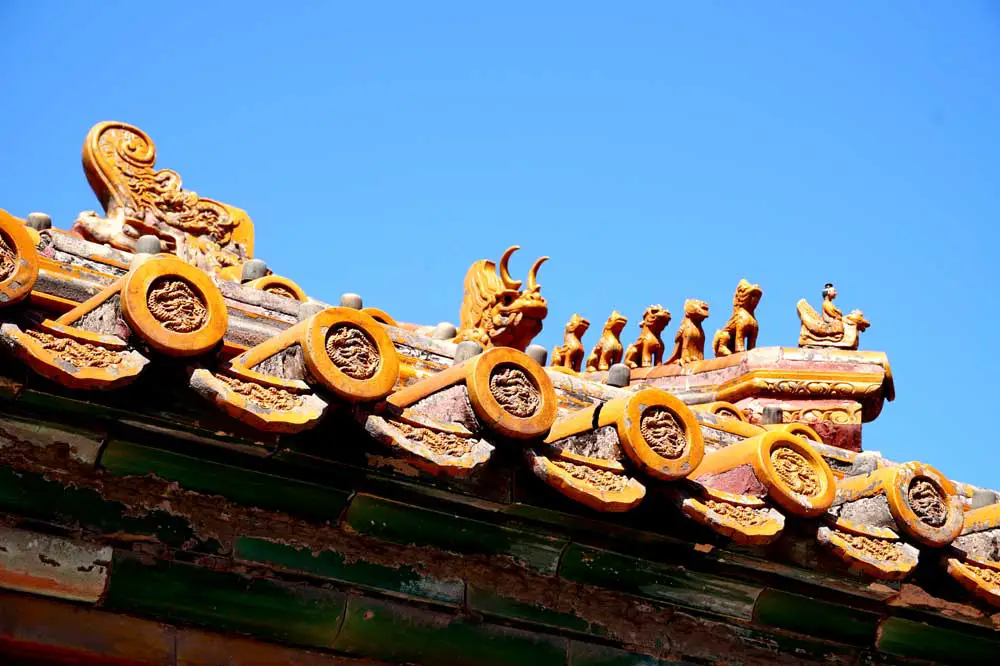 The figures and creatures on the roof eaves -the more there are, the more important the building is. The maximum is 10 at the Hall of Supreme Harmony, Forbidden City, Beijing | Laugh Travel Eat