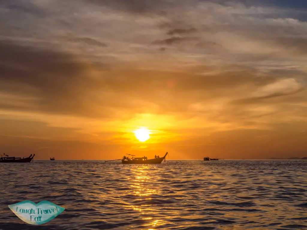 sunset on boat trip koh phi phi thailand - laugh travel eat
